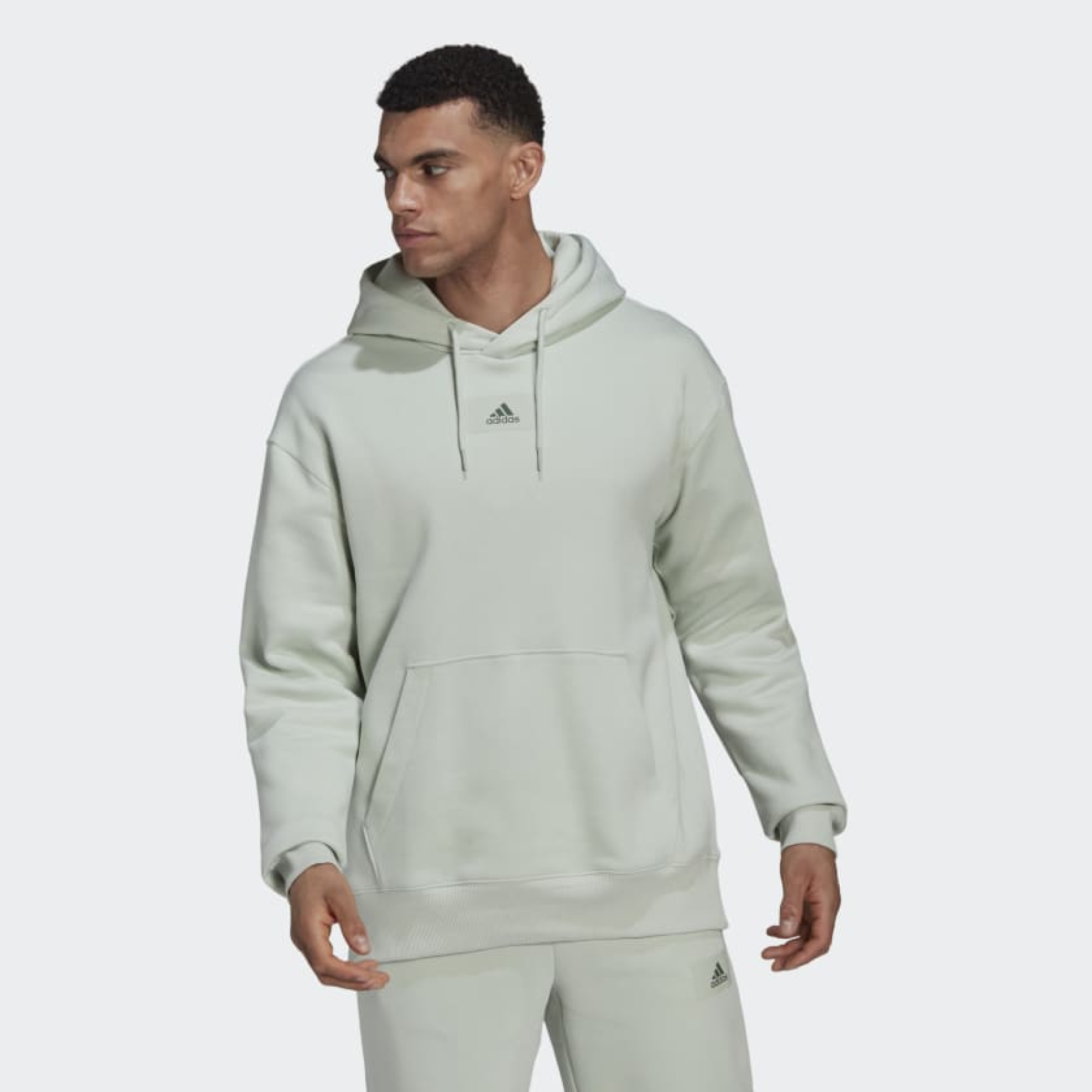 Adidas essentials hoodie green sale